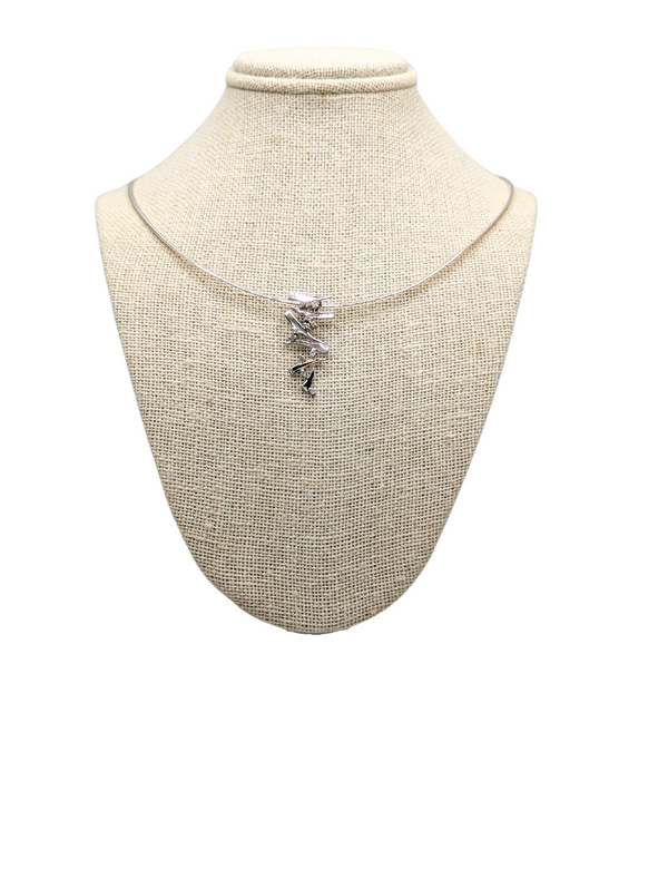 Abstract white gold and diamond pendant on Omega chain