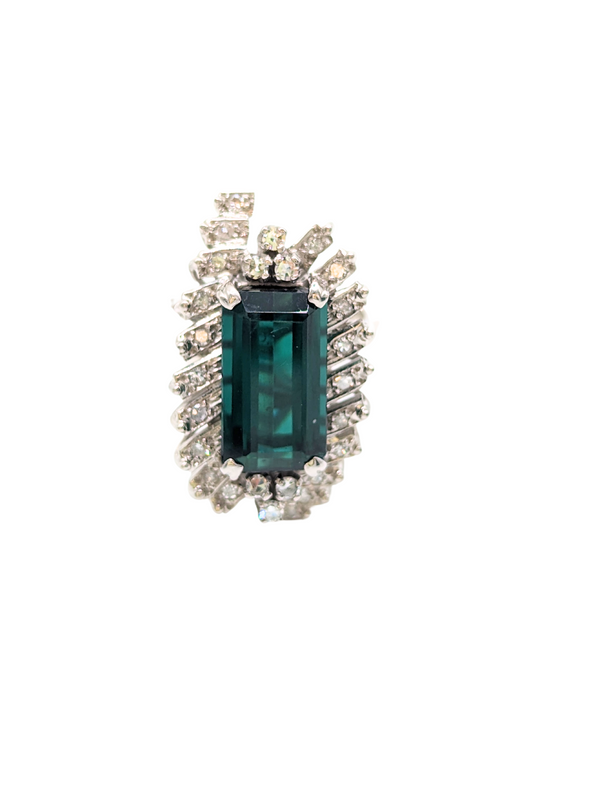 Green tourmaline surrounded by diamonds in starburst ring