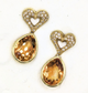 Diamond encrusted yellow gold heart earrings with citrine dangles