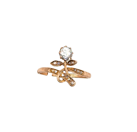 Dainty floral ring with diamond set in swirling gold