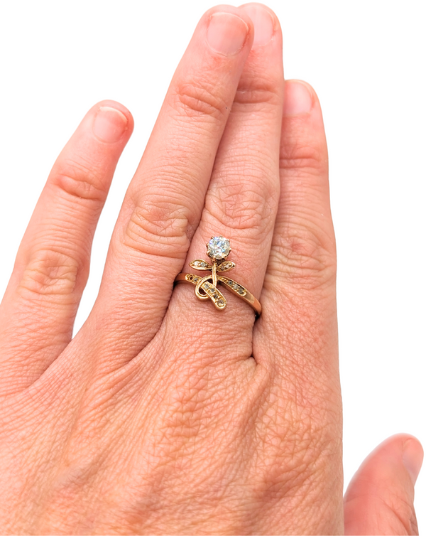 Dainty floral ring with diamond set in swirling gold