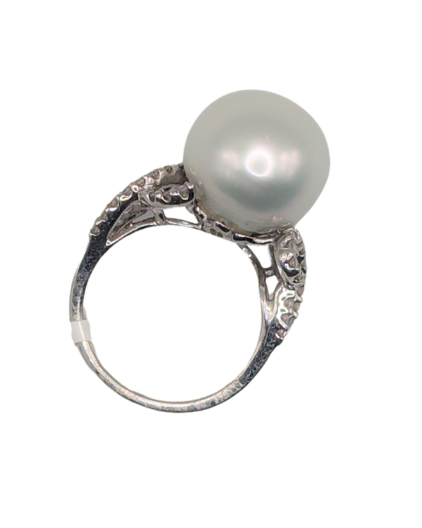 Large silver pearl ring with swirling diamond band