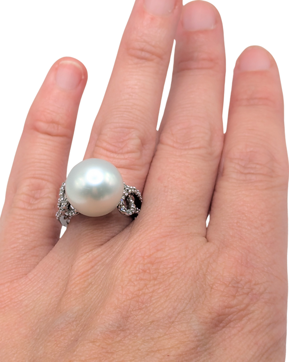 Large silver pearl ring with swirling diamond band