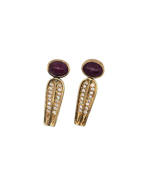 Interesting ruby and diamond earrings in sleek gold design