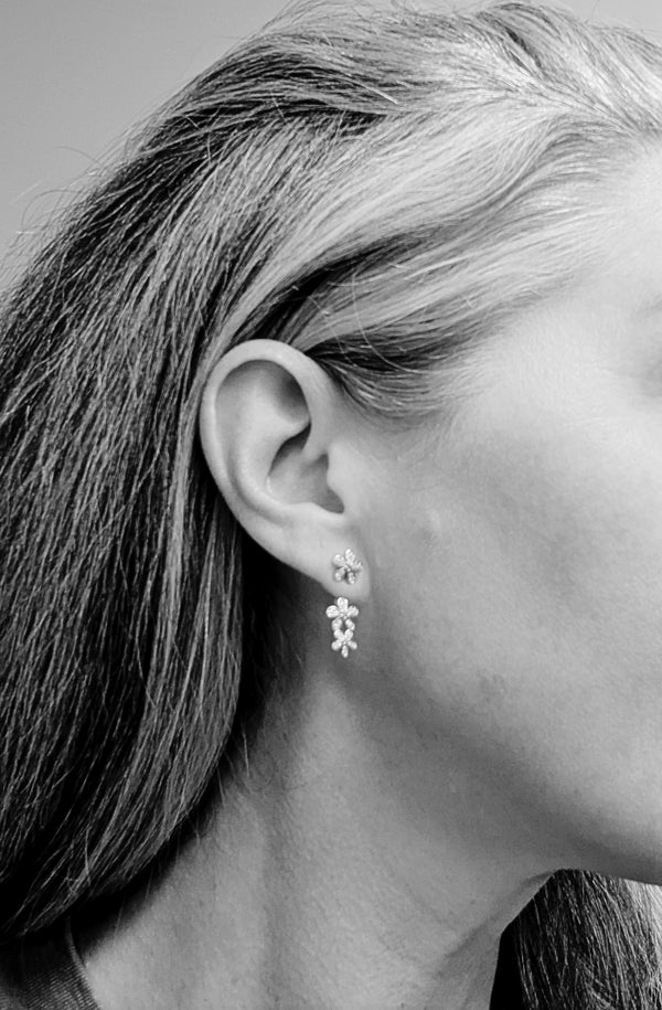 These earrings look dainty, but the enhancers give them a stylish edge.